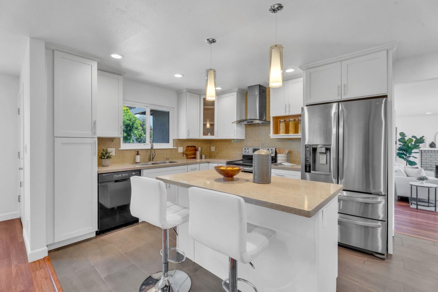 1165 Nadine Drive Campbell, CA 95008 - Photo 7 of 66 a kitchen with a sink a refrigerator and white cabinets