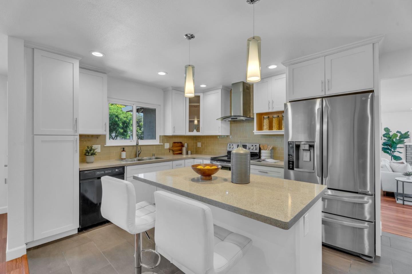 1165 Nadine Drive Campbell, CA 95008 - Photo 8 of 66 a kitchen with stainless steel appliances a refrigerator a sink a stove a dining table and chairs