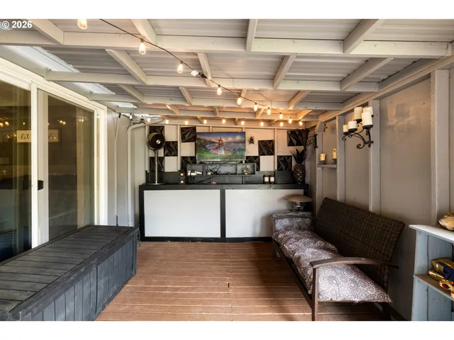 a kitchen with stainless steel appliances kitchen island granite countertop a refrigerator and microwave