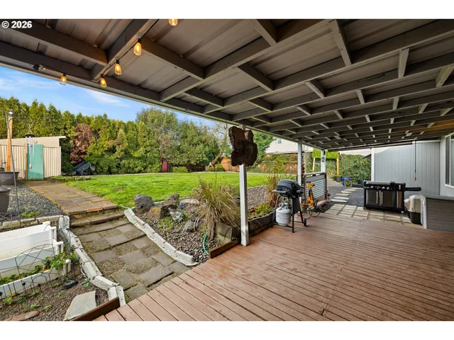 a view of a patio with table and chairs and potted plants