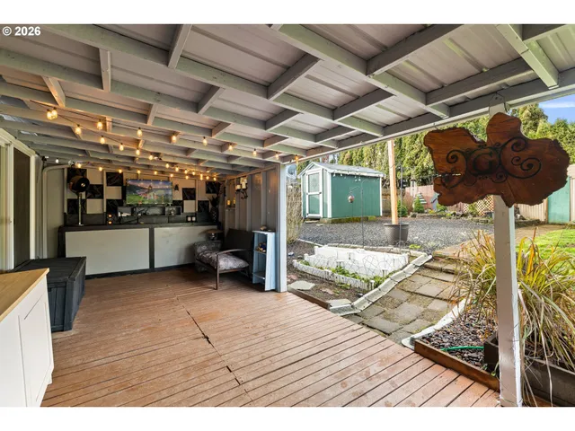 a view of a patio with wooden floor