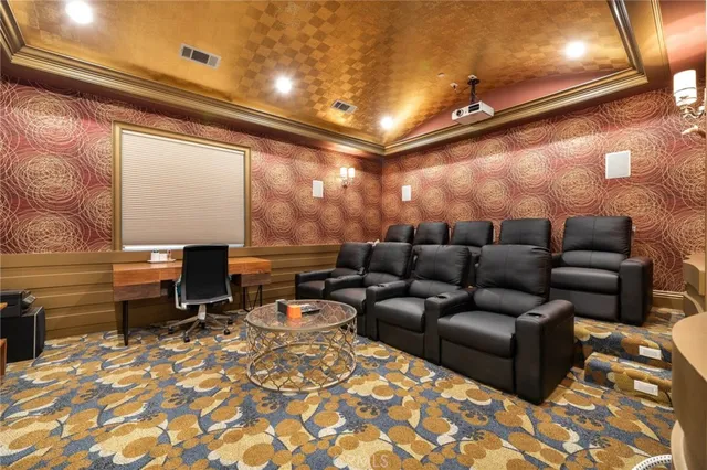 a kitchen with white cabinets and sink