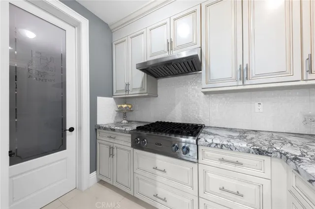 a view of a living room with furniture and a window