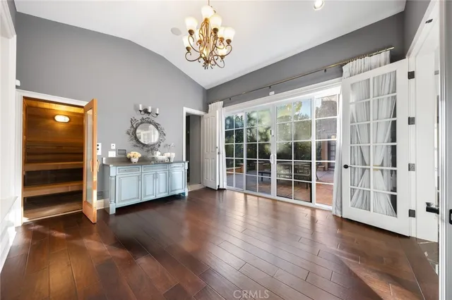 a view of a entryway door with wooden floor