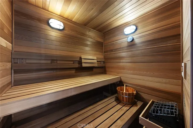 a spacious bathroom with a double vanity sink mirror and bathtub