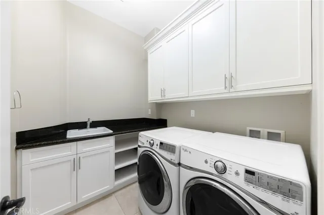 an aerial view of a house with a garden and a sign board