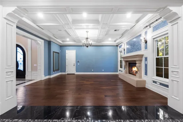 a view of a livingroom with furniture window and wooden floor