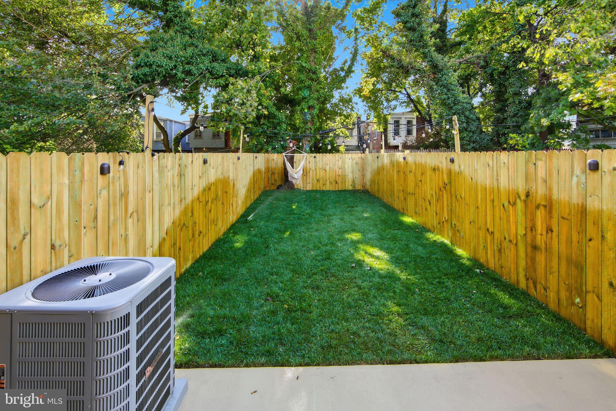 508 Taylor Street Wilmington, DE 19801 - Photo 13 of 46 a view of backyard with tub and trees