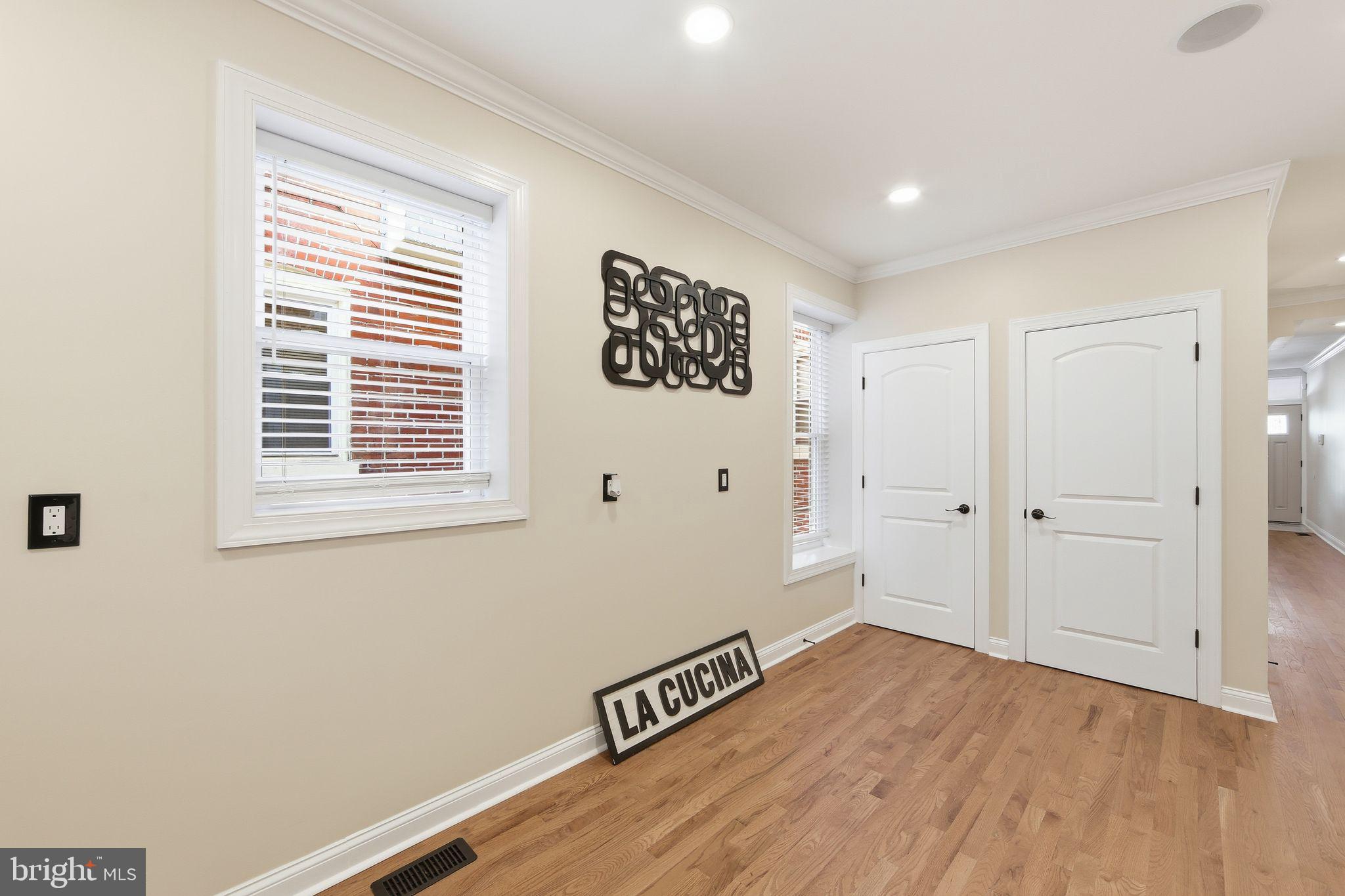 508 Taylor Street Wilmington, DE 19801 - Photo 17 of 46 a view of an empty room with wooden floor and a window