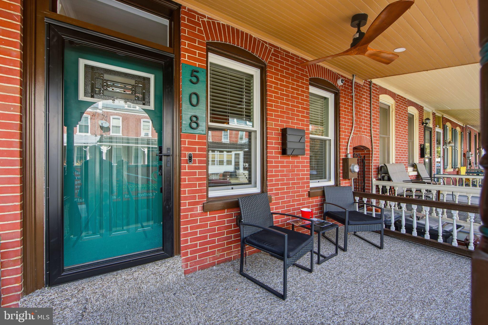 508 Taylor Street Wilmington, DE 19801 - Photo 2 of 46 a backyard of a house with barbeque oven table and chairs