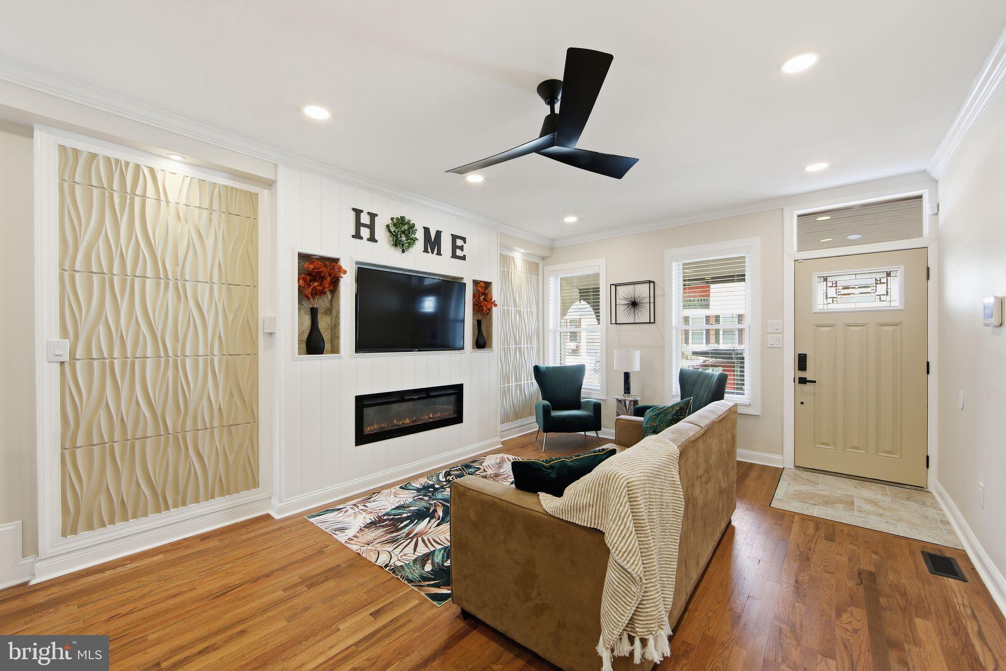 508 Taylor Street Wilmington, DE 19801 - Photo 24 of 46 a living room with furniture flat screen tv and a fireplace