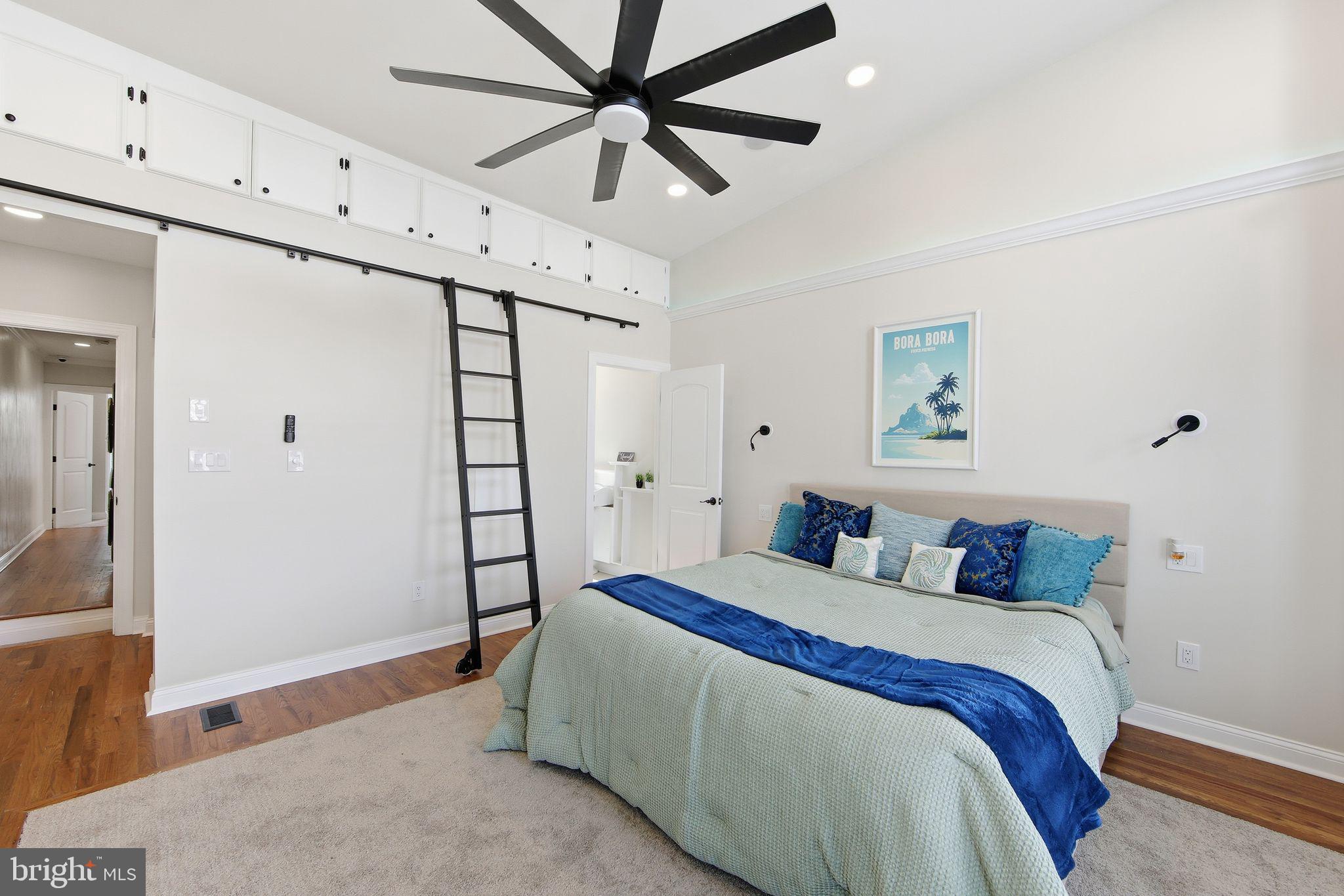 508 Taylor Street Wilmington, DE 19801 - Photo 27 of 46 a bedroom with a large bed and a chandelier