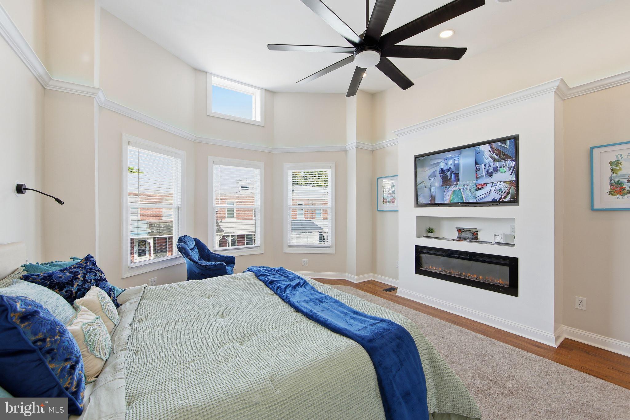 508 Taylor Street Wilmington, DE 19801 - Photo 29 of 46 a bedroom with a large bed and a chandelier