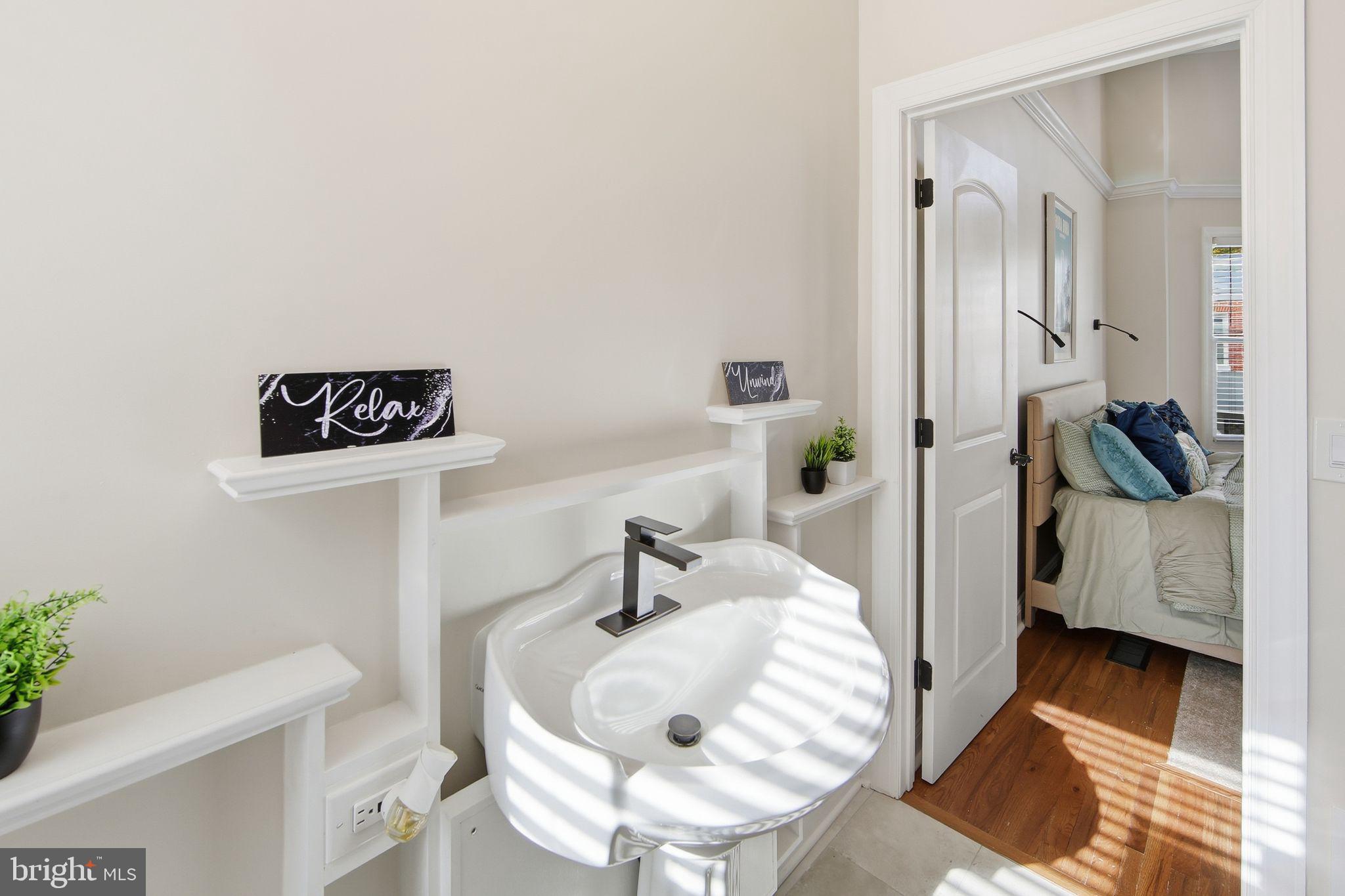 508 Taylor Street Wilmington, DE 19801 - Photo 32 of 46 a bedroom with a bed and a view of living room