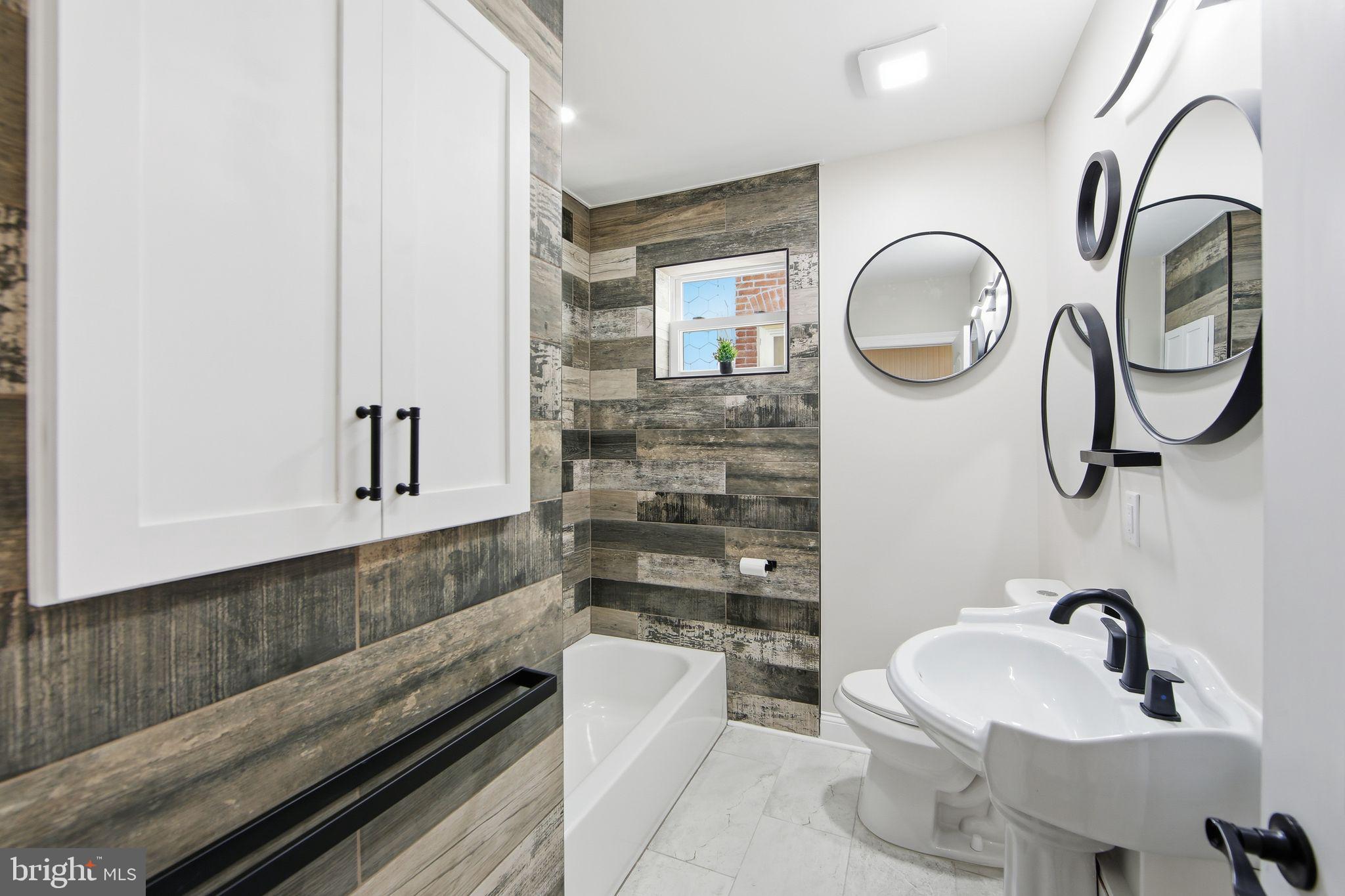 508 Taylor Street Wilmington, DE 19801 - Photo 35 of 46 a bathroom with a toilet sink and mirror