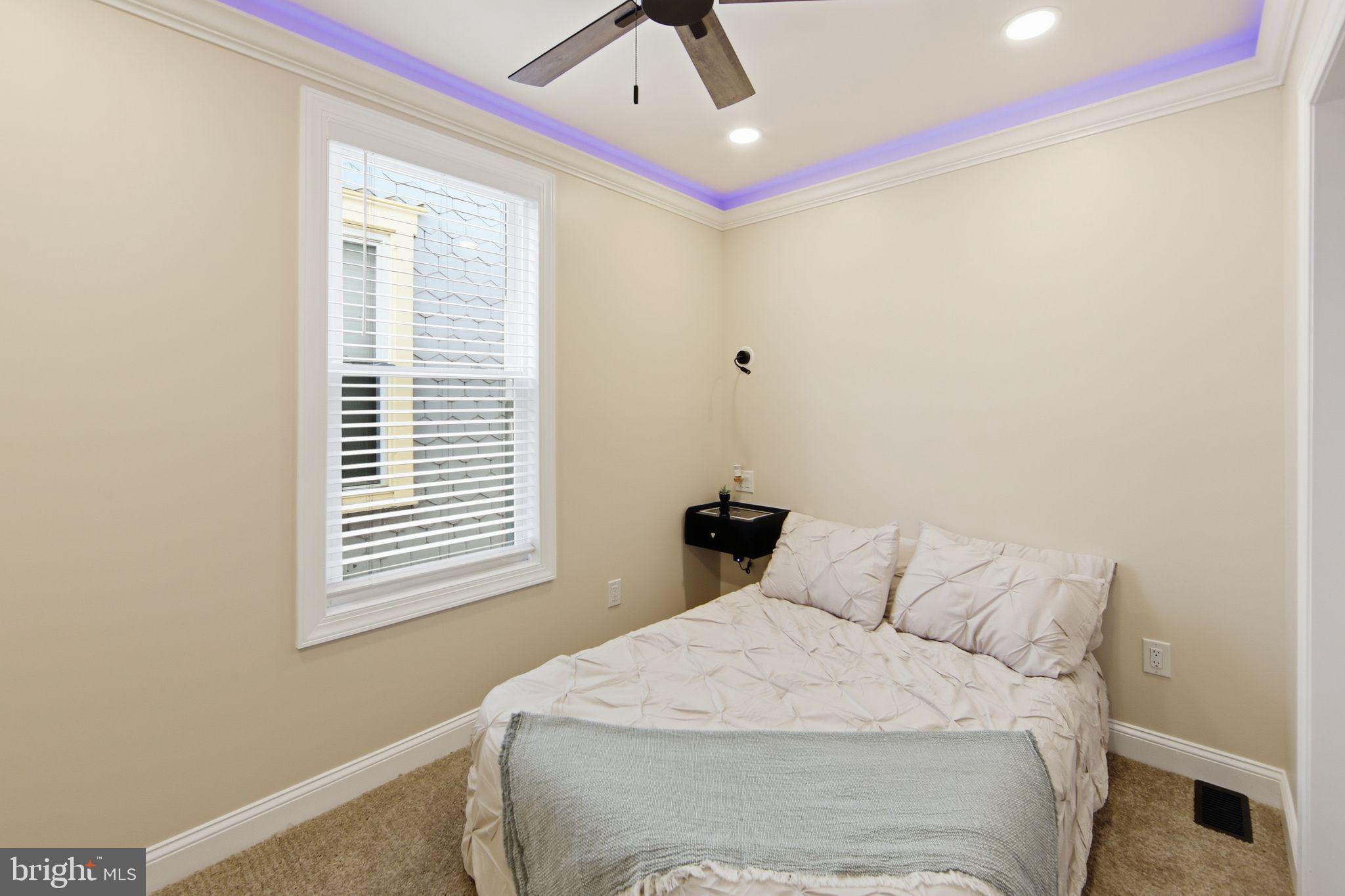 508 Taylor Street Wilmington, DE 19801 - Photo 37 of 46 a bedroom with a bed and a window