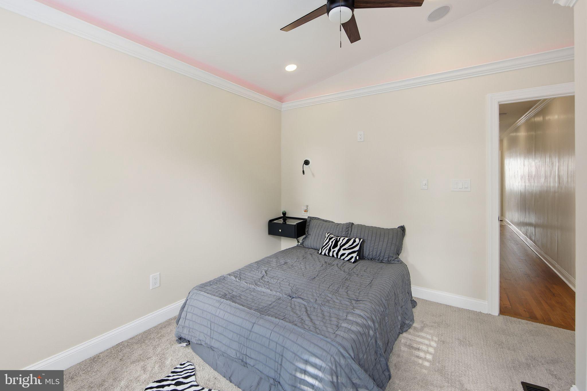 508 Taylor Street Wilmington, DE 19801 - Photo 42 of 46 a bedroom with a bed and a ceiling fan
