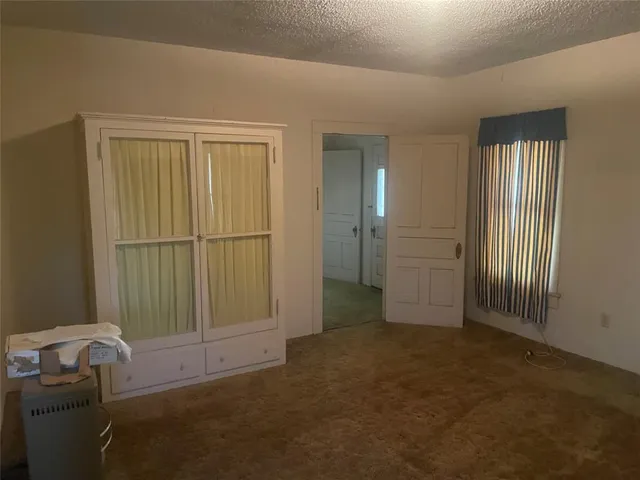 an empty room that has a window