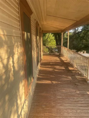 a view of a pathway both side of house
