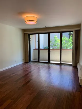 a kitchen with stainless steel appliances granite countertop a refrigerator and a stove