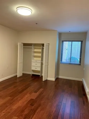 a kitchen with granite countertop a stove and a microwave