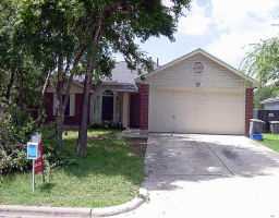 5403 China Berry Road Austin, TX 78744 - Photo 1 of 1 a front view of house with a garden