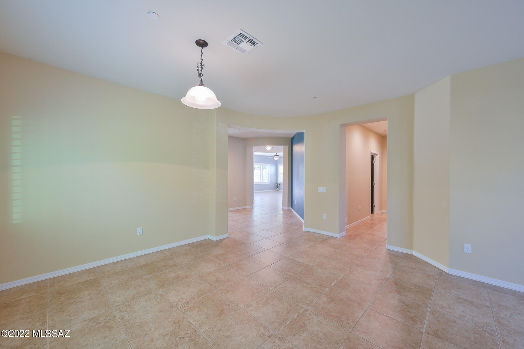 10804 East Salsabila Road Tucson, AZ 85747 - Photo 11 of 50 a view of a room with wooden floor and windows
