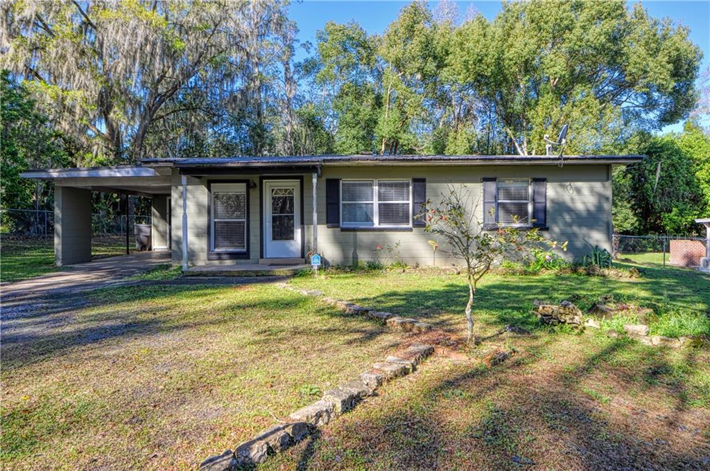 122 Northeast 37th Terrace Ocala, FL 34470 - Photo 1 of 1 a view of a house with backyard and plants