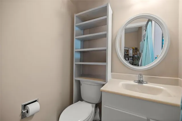 a living room with furniture a lamp and a floor to ceiling window