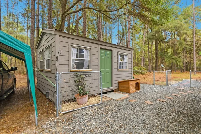 a room with furniture and kitchen view