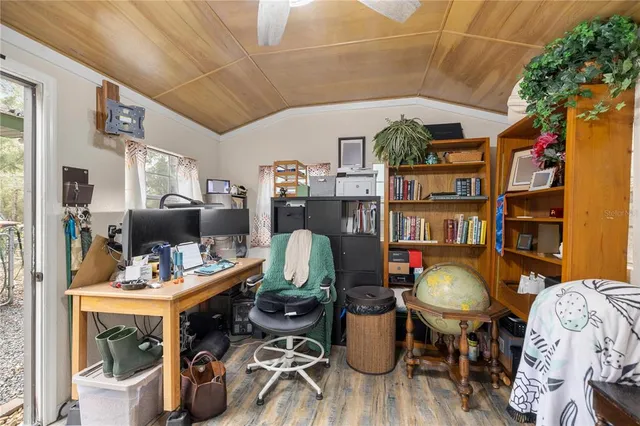 a view of a house with a yard and garage