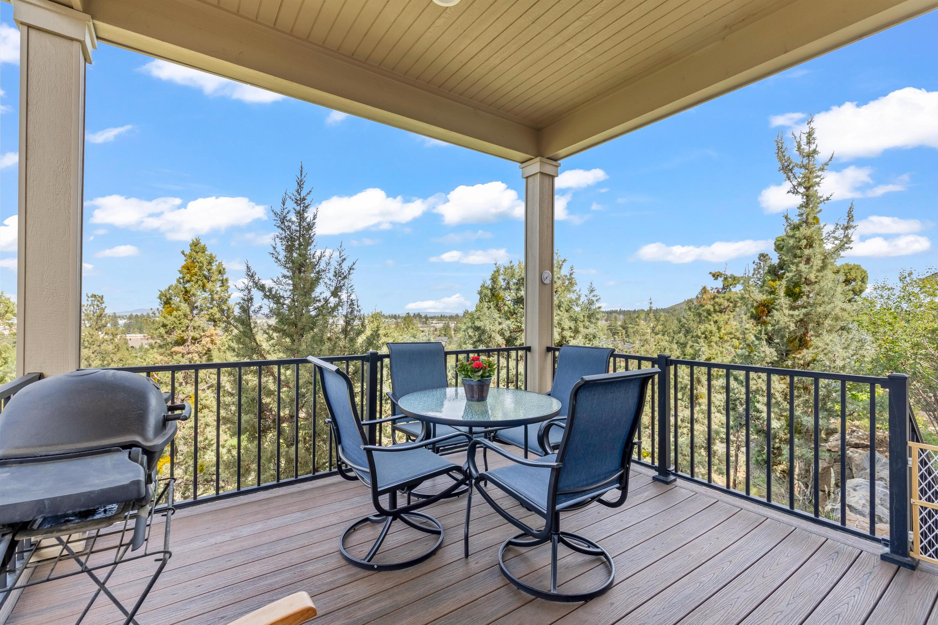 2375 Northwest Majestic Ridge Drive Bend, OR 97703 - Photo 16 of 28 a view of a balcony with furniture and wooden floor