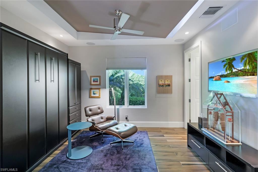 2296 Hawks Ridge Loop Naples, FL 34105 - Photo 21 of 50 Third bedroom with Murphy bed.