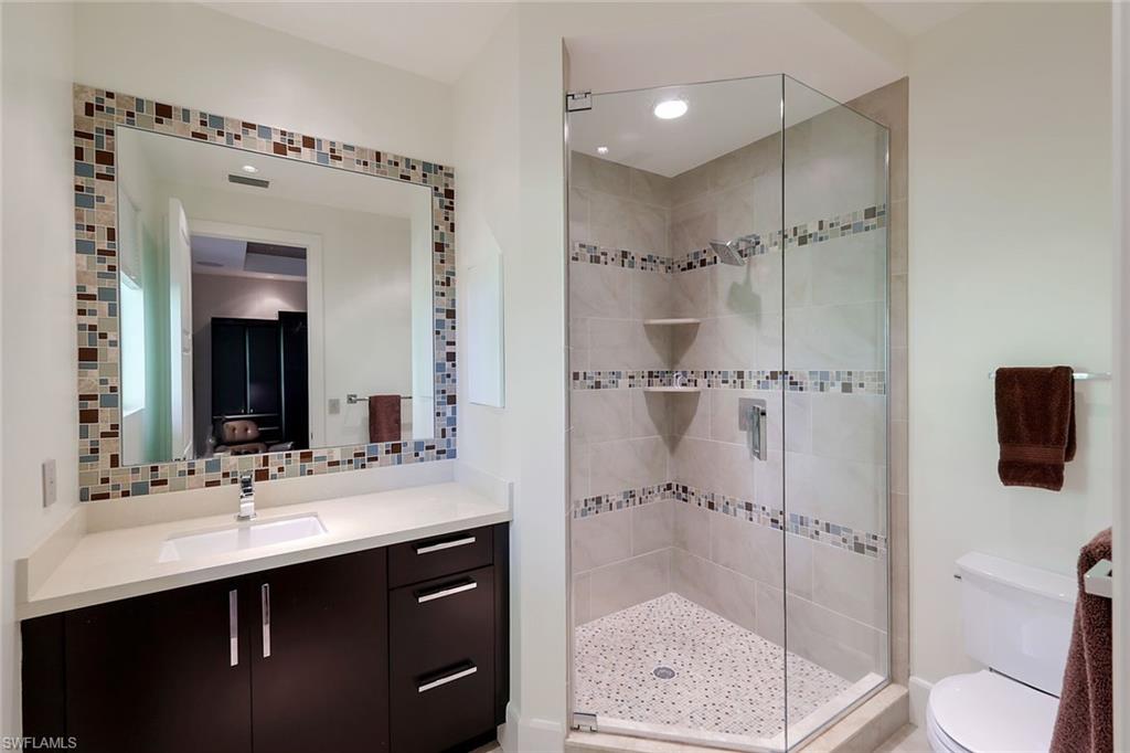 2296 Hawks Ridge Loop Naples, FL 34105 - Photo 22 of 50 Third bedroom ensuite bath.