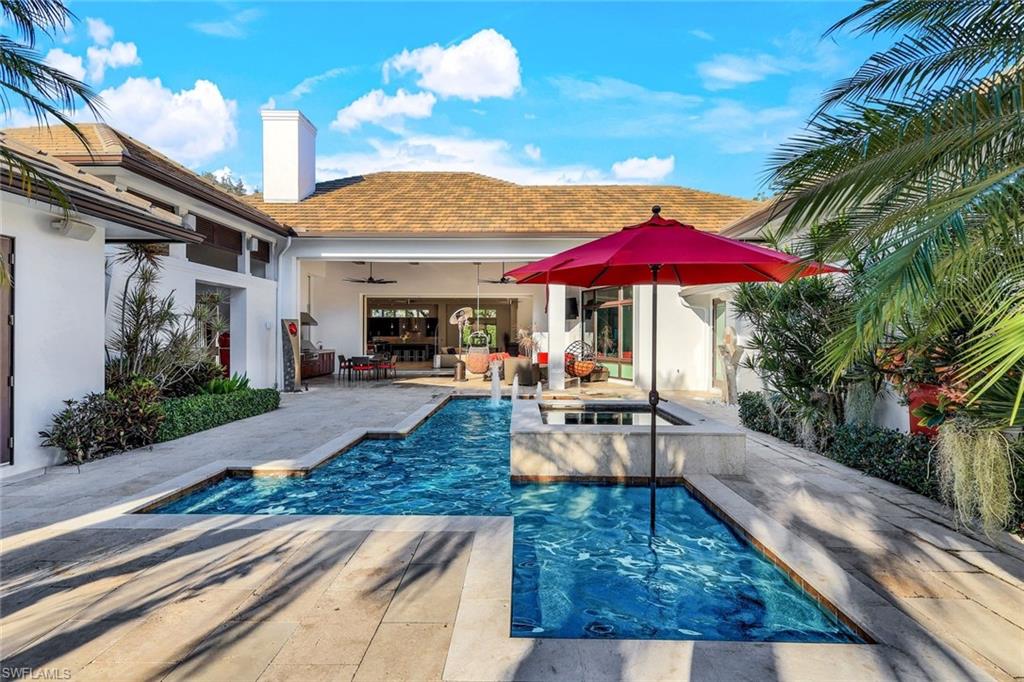 2296 Hawks Ridge Loop Naples, FL 34105 - Photo 3 of 50 Lanai, pool and spa from end of courtyard.