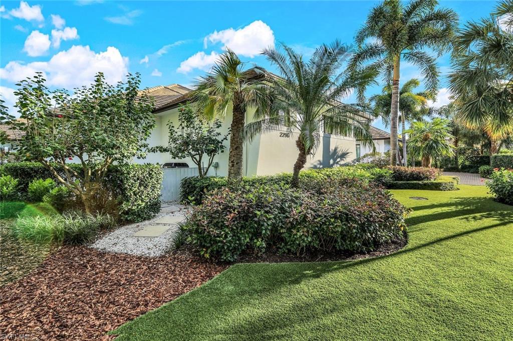 2296 Hawks Ridge Loop Naples, FL 34105 - Photo 40 of 50 Side of home leading to generator complete with high-end artificial turf for easy maintenance.