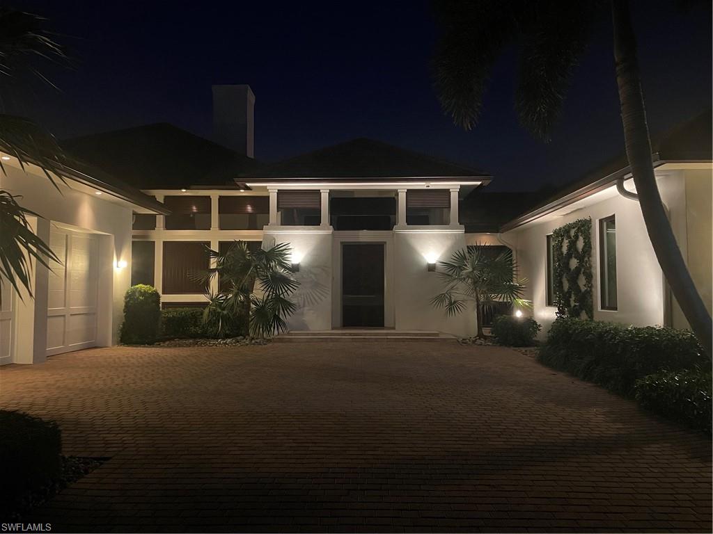 2296 Hawks Ridge Loop Naples, FL 34105 - Photo 50 of 50 Entrance to home after dark.