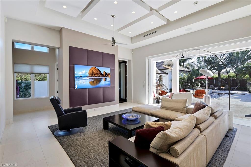 2296 Hawks Ridge Loop Naples, FL 34105 - Photo 10 of 50 Living area that seamless transitions to the outdoor space.