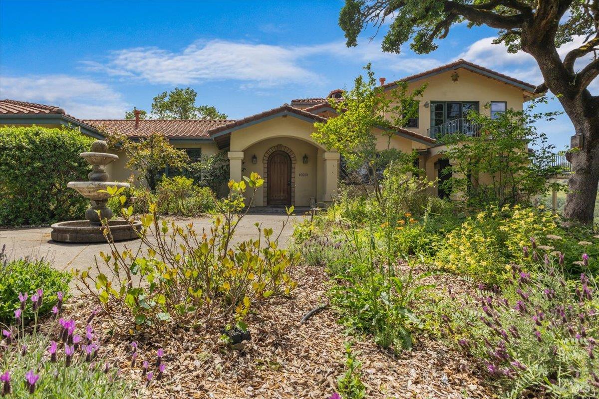 13404 Flora Ranch Road Healdsburg, CA 95448 - Photo 12 of 83 a front view of a house with a yard