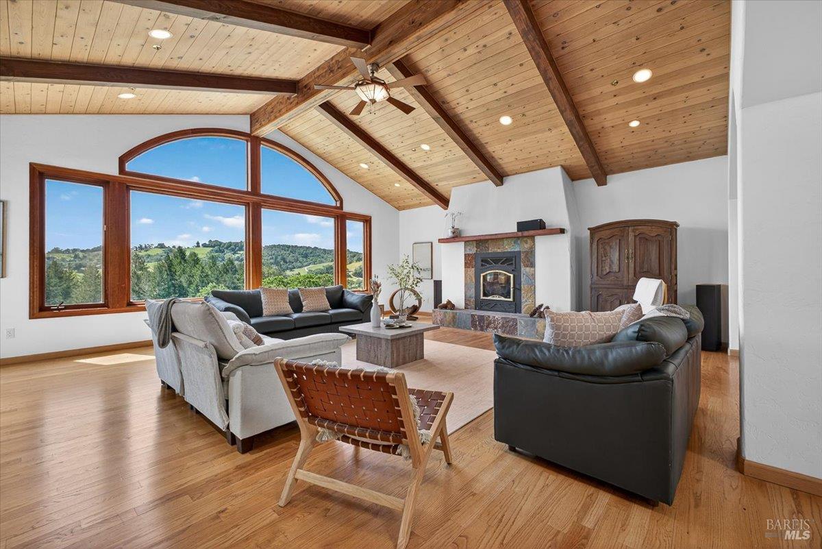 13404 Flora Ranch Road Healdsburg, CA 95448 - Photo 15 of 83 a living room with fireplace furniture and a large window