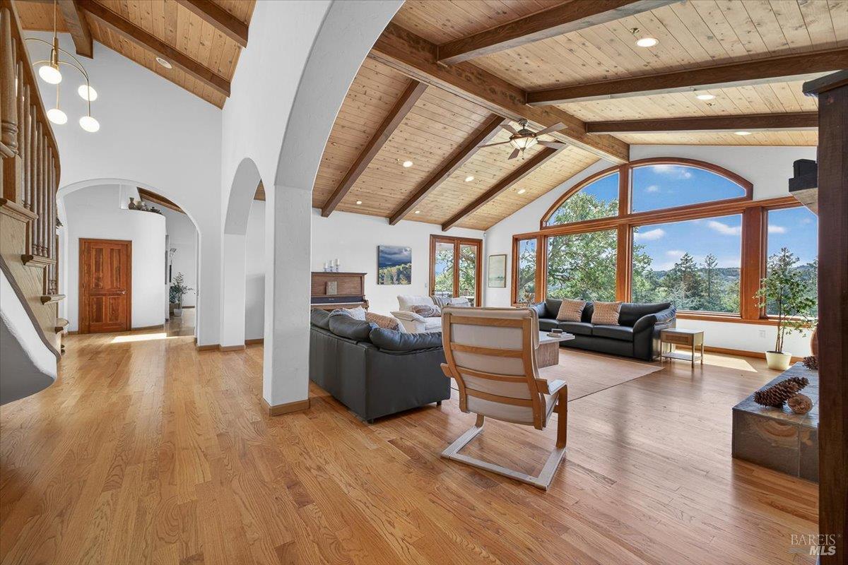 13404 Flora Ranch Road Healdsburg, CA 95448 - Photo 19 of 83 a living room with furniture a wooden floor and a large window