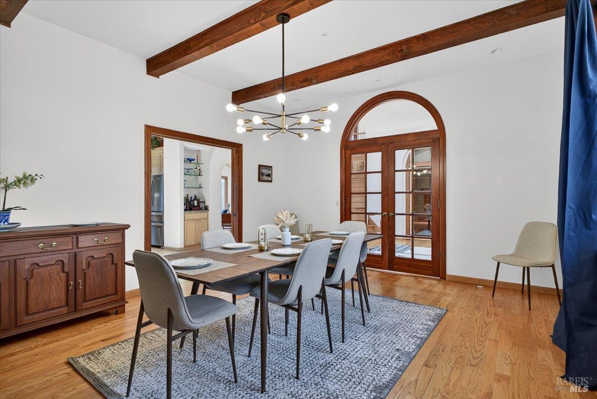 13404 Flora Ranch Road Healdsburg, CA 95448 - Photo 24 of 83 a view of a dining room with furniture and wooden floor