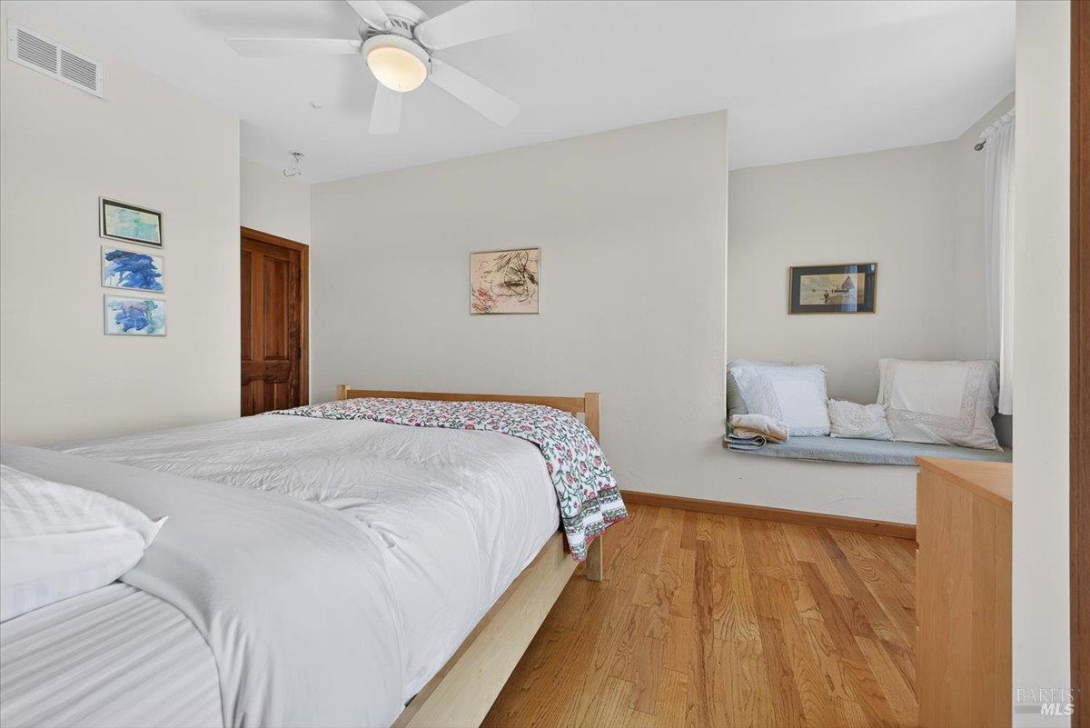 13404 Flora Ranch Road Healdsburg, CA 95448 - Photo 40 of 83 a bedroom with a bed and a lamp on table