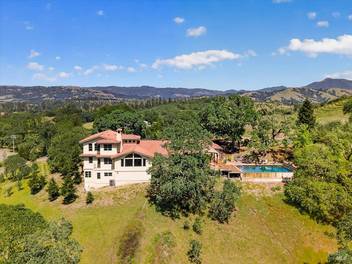 13404 Flora Ranch Road Healdsburg, CA 95448 - Photo 4 of 83 a view of a lake with a mountain in the background