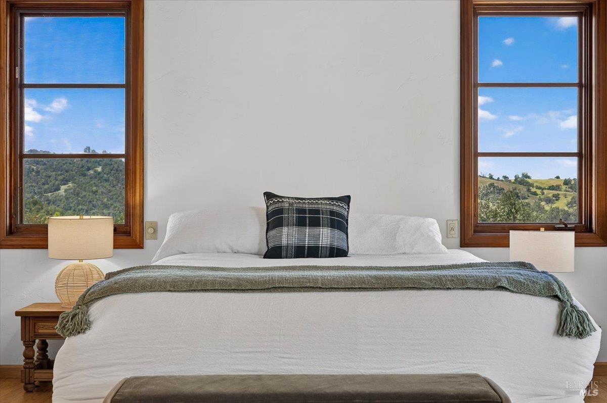 13404 Flora Ranch Road Healdsburg, CA 95448 - Photo 47 of 83 a bedroom with a bed and window