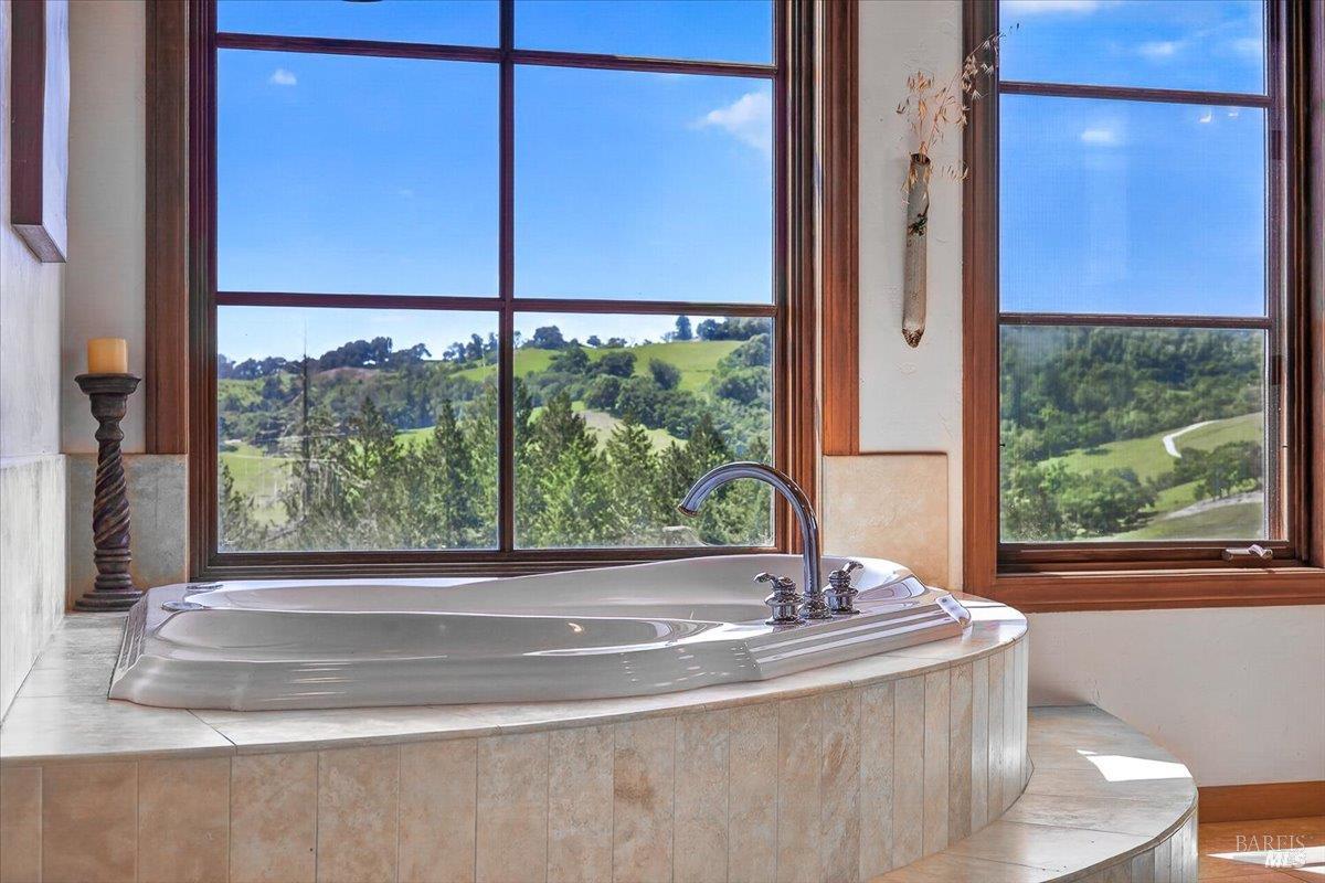 13404 Flora Ranch Road Healdsburg, CA 95448 - Photo 52 of 83 a view of a bathroom with a tub and window