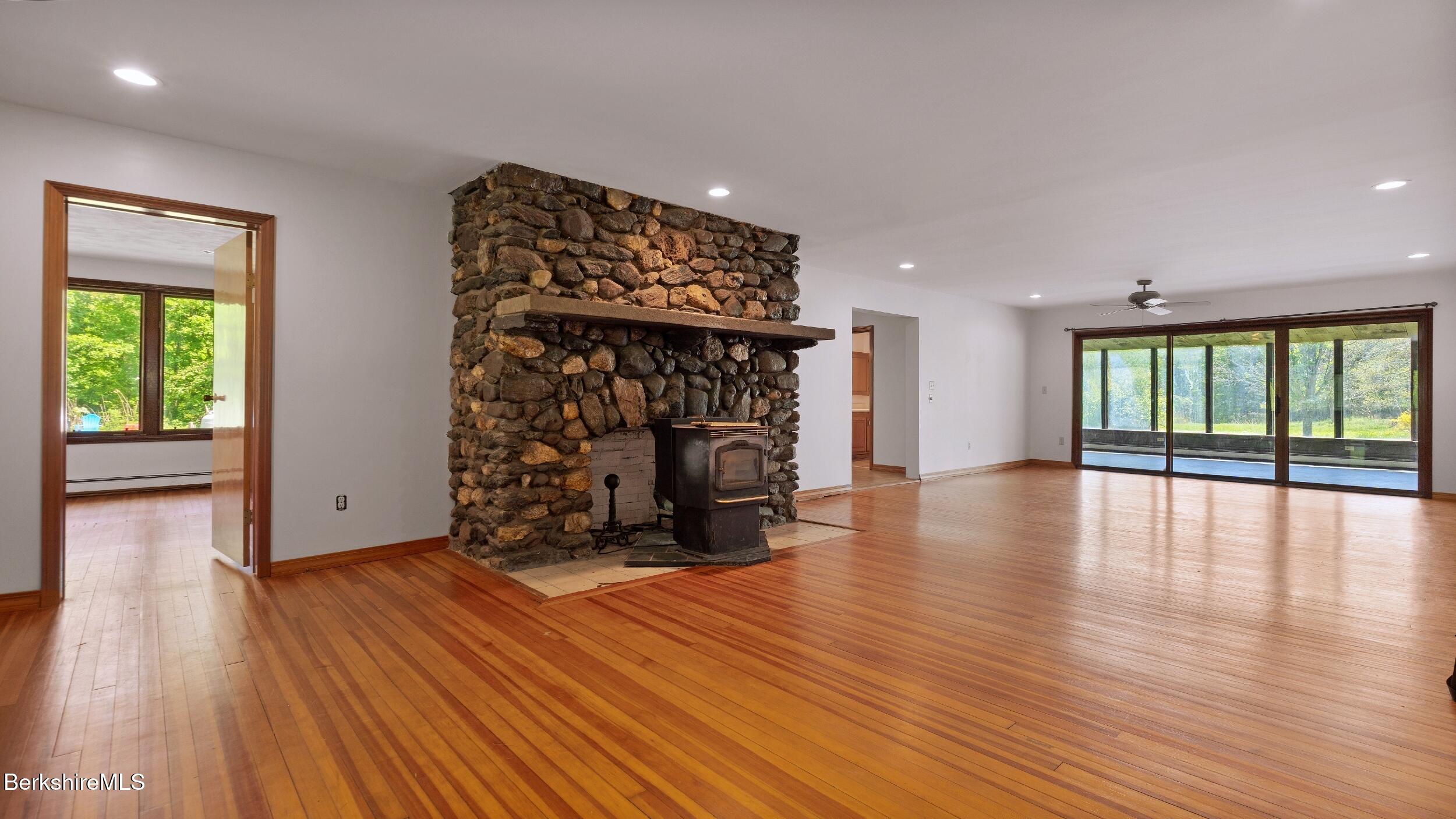 20 East Dugway Road Lenox, MA 01240 - Photo 17 of 84 a view of a room with wooden floor fireplace and windows