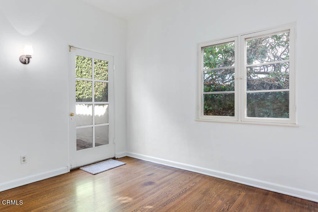 2452 Boulder Road Altadena, CA 91001 - Photo 11 of 33 an empty room with wooden floor and windows