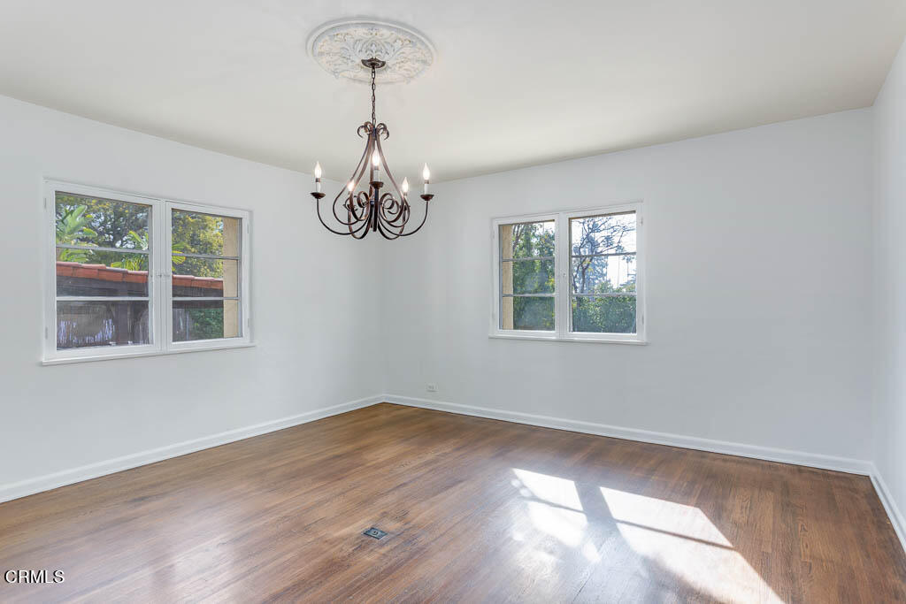 2452 Boulder Road Altadena, CA 91001 - Photo 13 of 33 a view of an empty room with wooden floor and a window