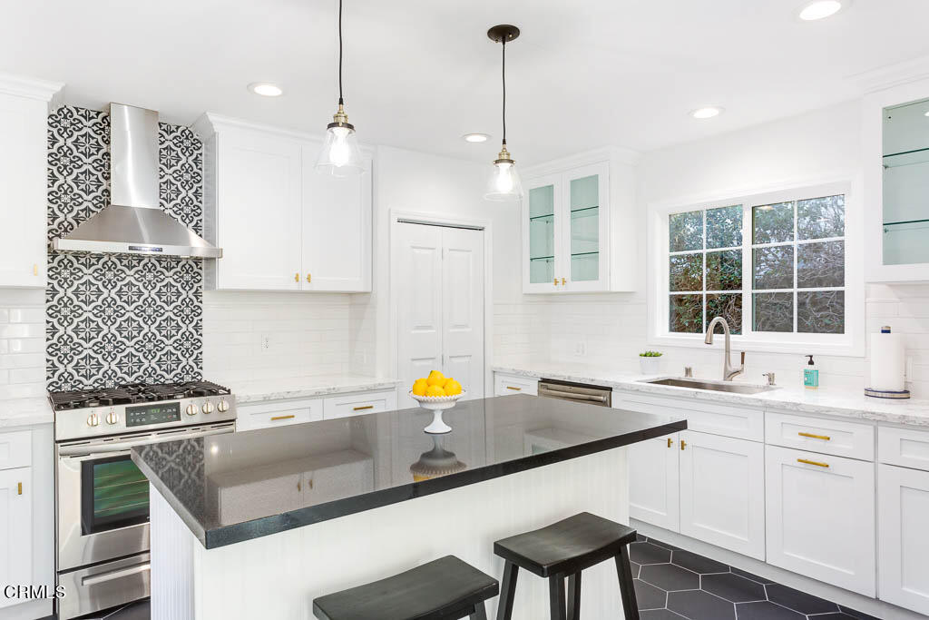 2452 Boulder Road Altadena, CA 91001 - Photo 16 of 33 a kitchen that has a sink stove and cabinets